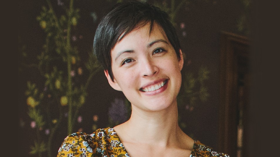 headshot of woman with short dark hair smiling